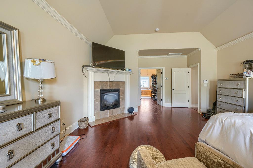 345 Masters Club Boulevard Hampton, GA 30228 - Photo 19 of 30 a living room with furniture and a fireplace