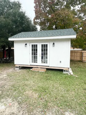 a house view with a backyard space