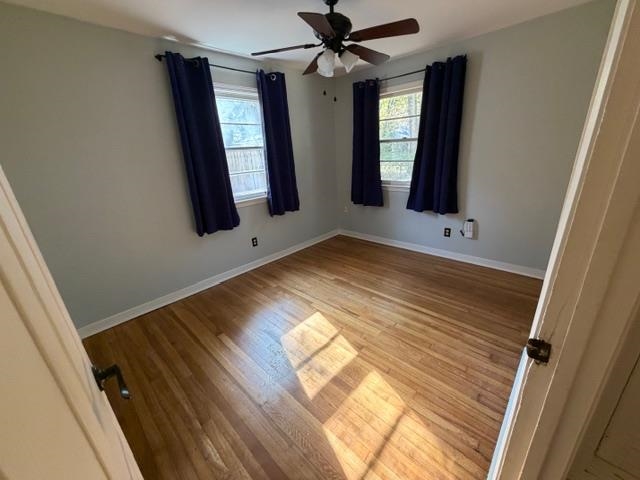 1219 South White Station Road Memphis, TN 38117 - Photo 12 of 18 a view of hallway with window and wooden floor