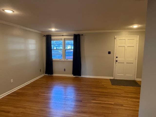 1219 South White Station Road Memphis, TN 38117 - Photo 3 of 18 a view of an empty room with wooden floor and a window