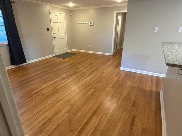 1219 South White Station Road Memphis, TN 38117 - Photo 4 of 18 a view of an empty room with wooden floor