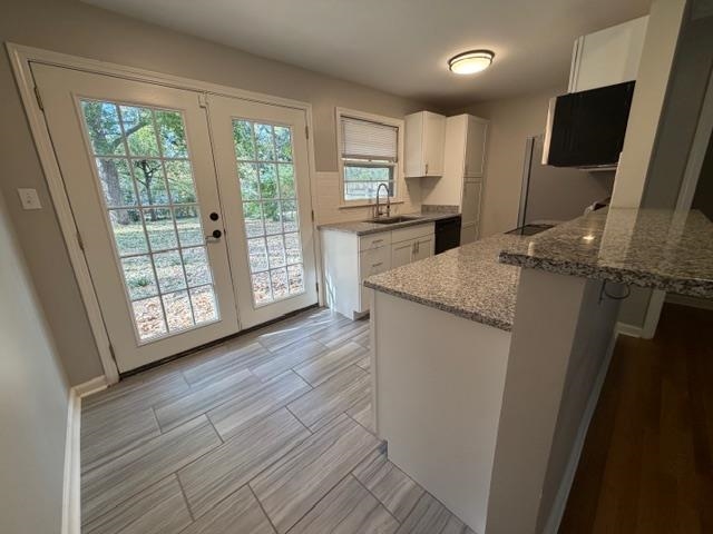 1219 South White Station Road Memphis, TN 38117 - Photo 9 of 18 a kitchen with appliances cabinets and a sink
