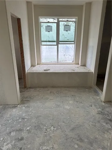 a bathroom with bathtub and a window