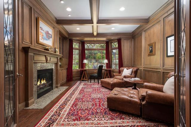 a living room with furniture fireplace and flat screen tv