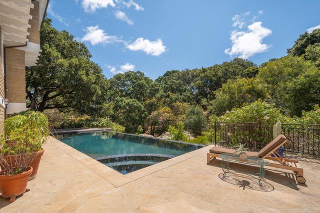 a view of a swimming pool with a lounge chairs