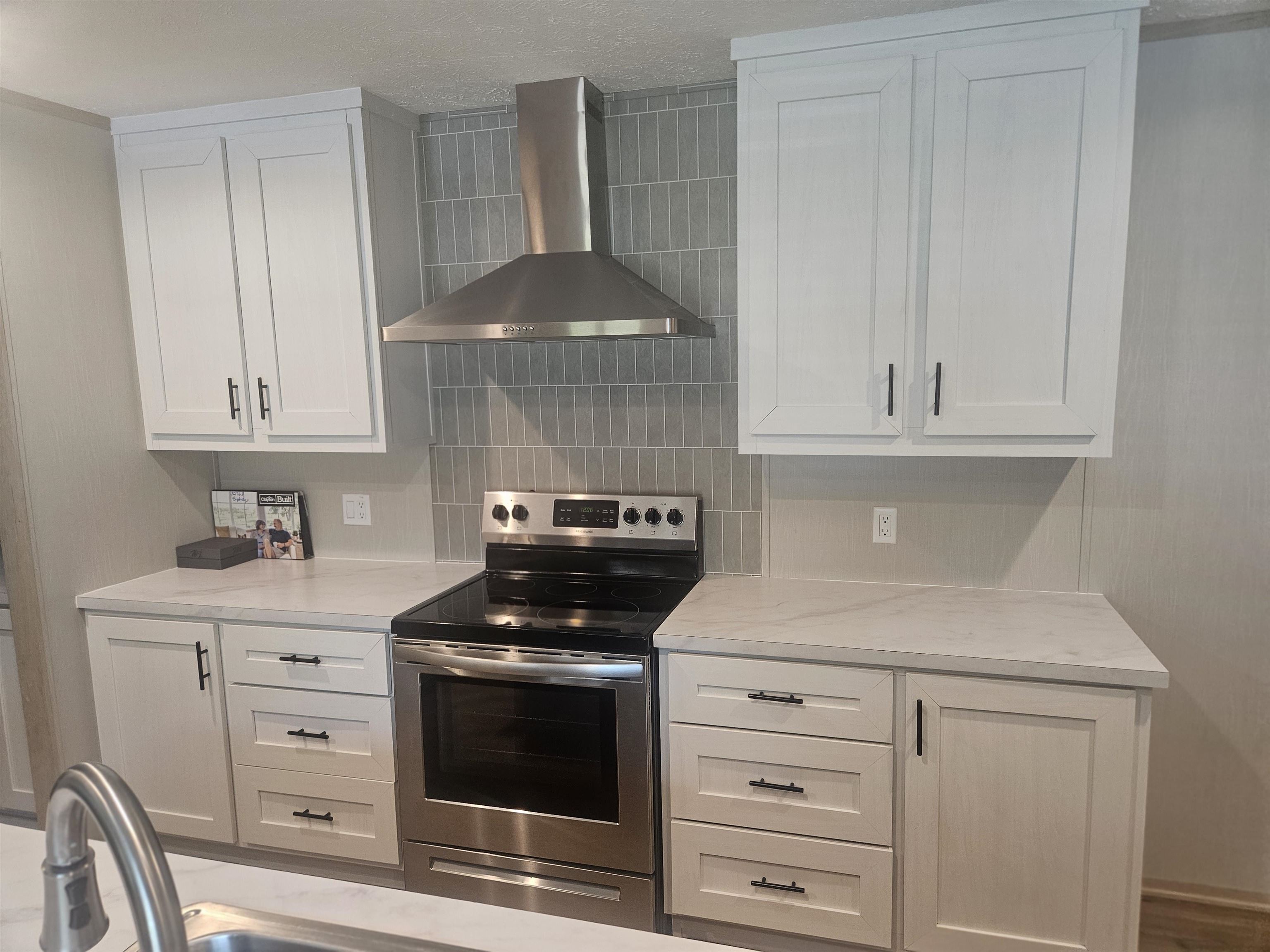 75 Pittman Road, Unit ROAD Somerville, TN 38068 - Photo 7 of 26 Kitchen featuring a stainless steel range and coordinating range hood