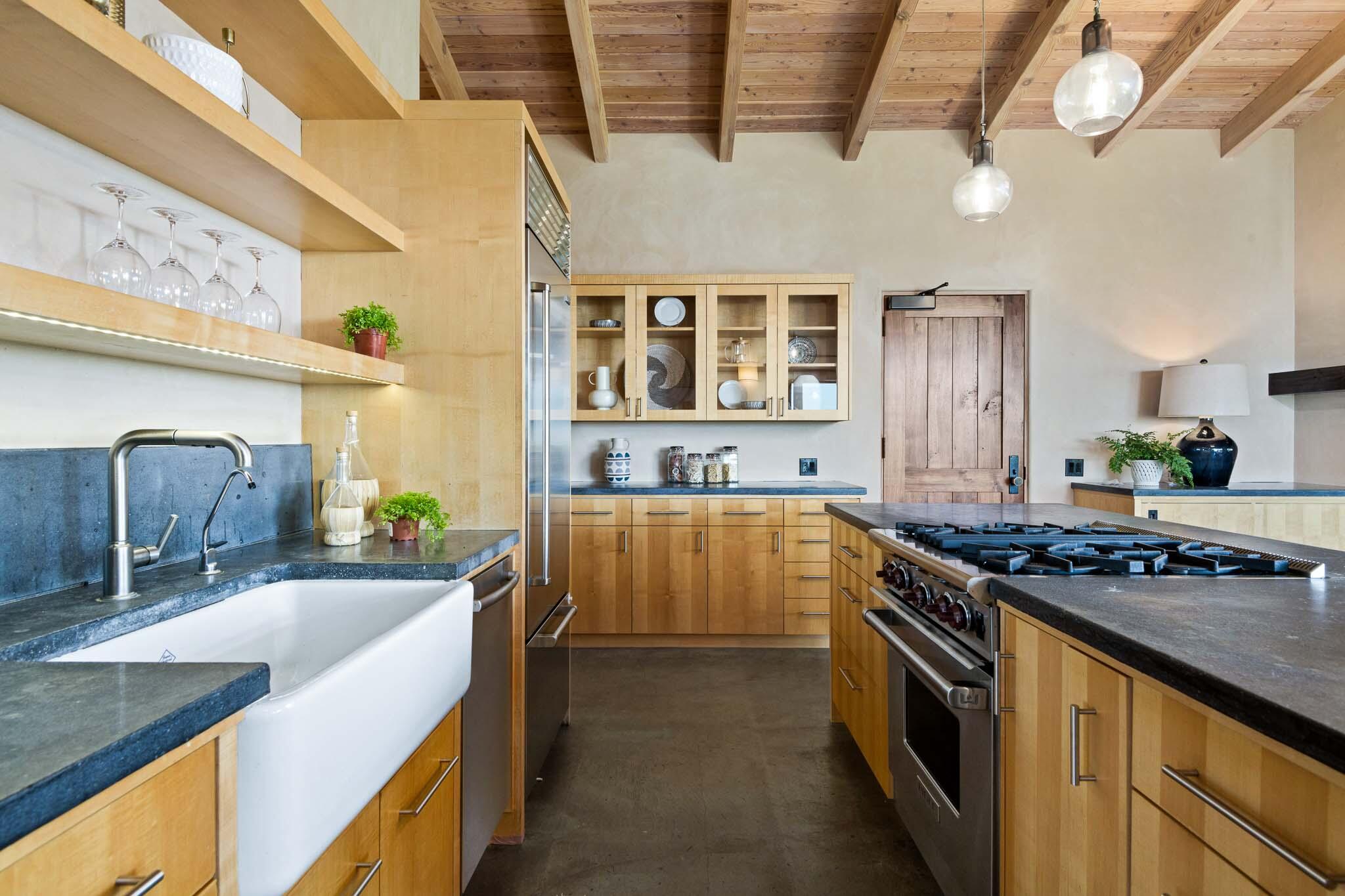 356 East Mountain Drive Montecito, CA 93108 - Photo 11 of 36 a kitchen with stainless steel appliances granite countertop a sink and stove