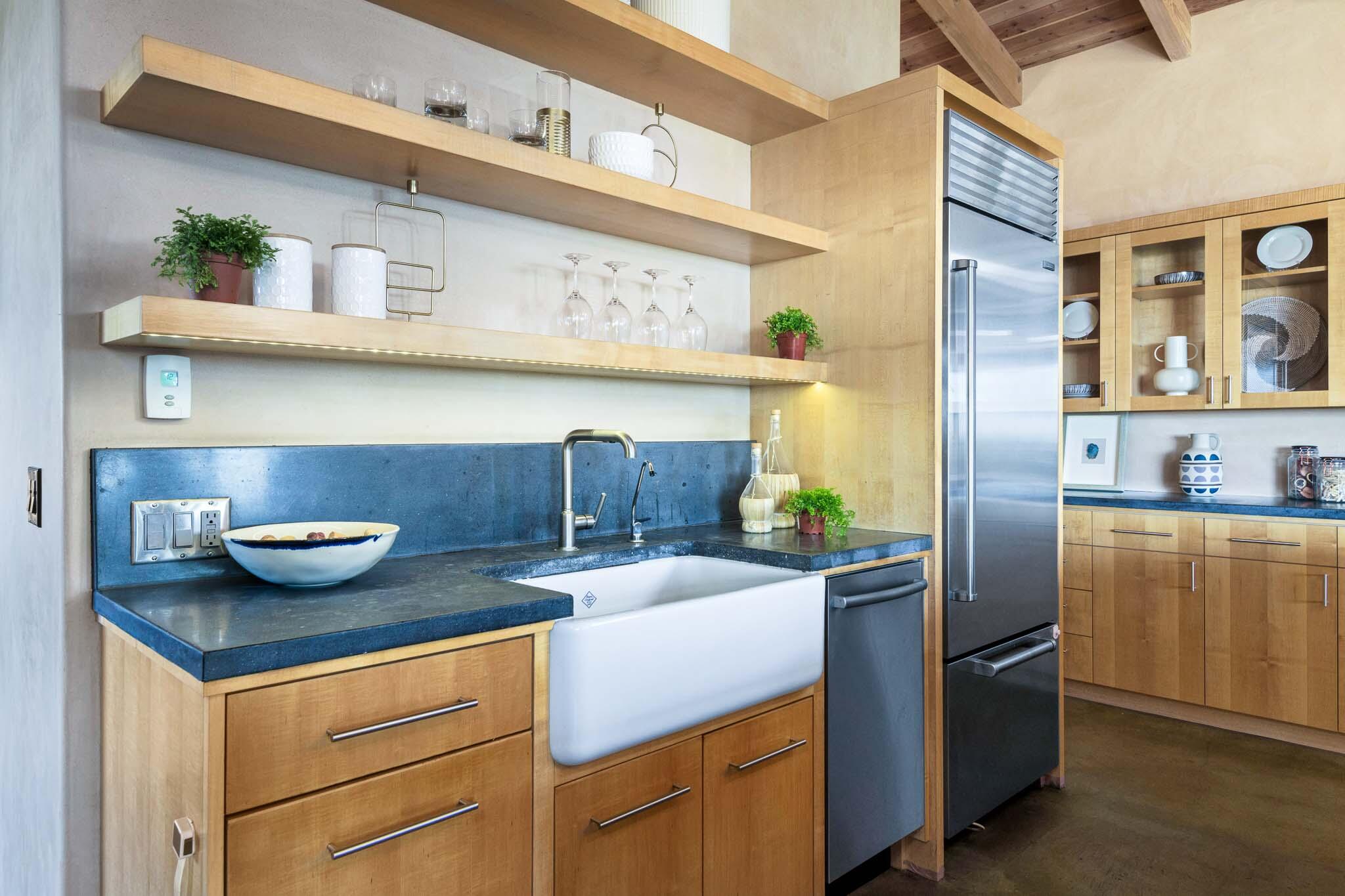 356 East Mountain Drive Montecito, CA 93108 - Photo 6 of 36 a kitchen with stainless steel appliances granite countertop a sink and cabinets