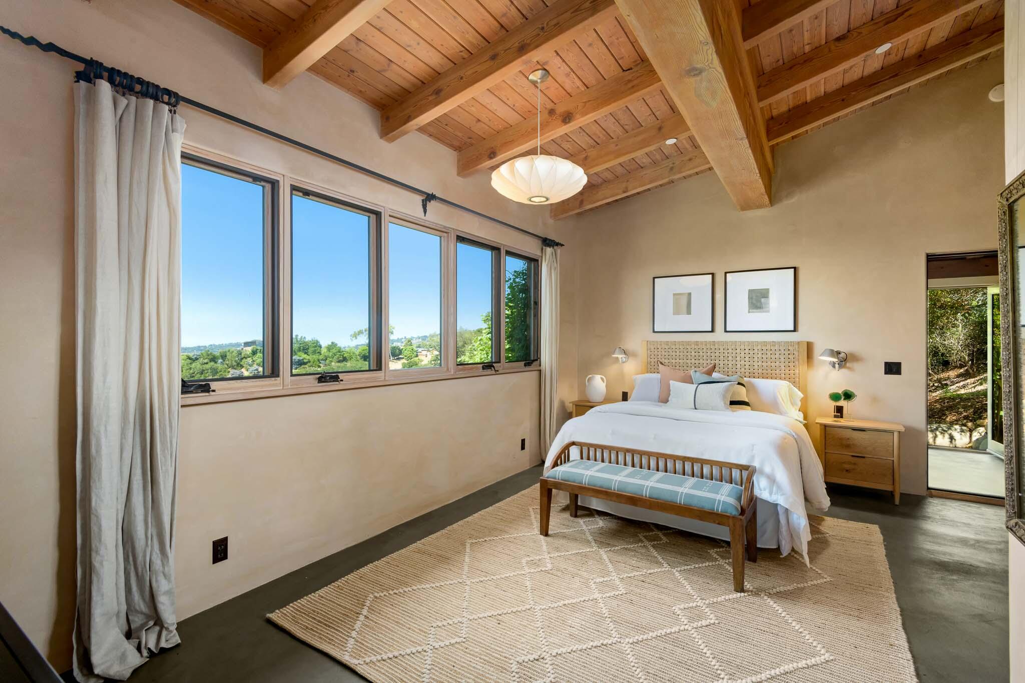 356 East Mountain Drive Montecito, CA 93108 - Photo 9 of 36 a bedroom with a bed and a large window