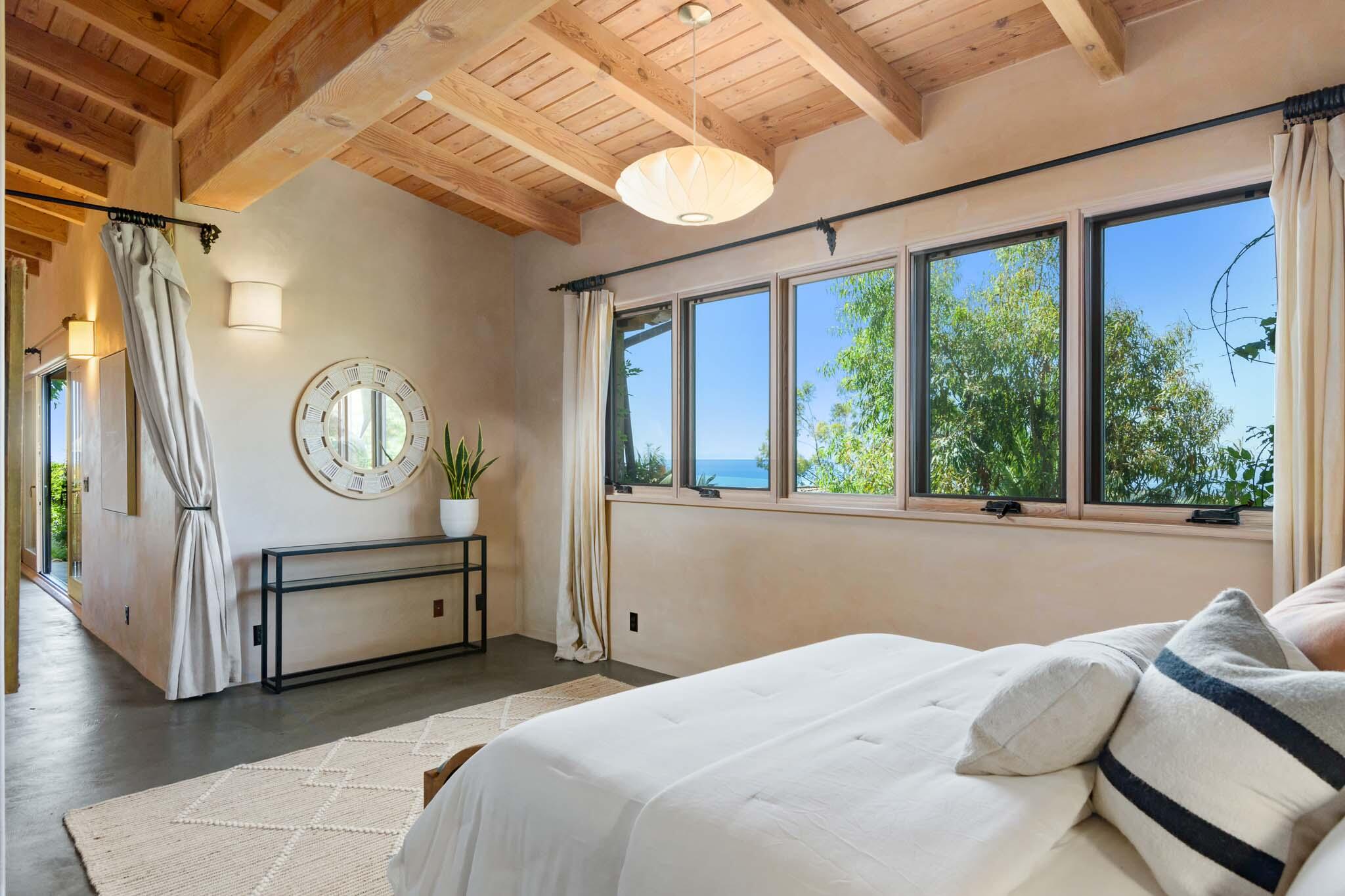 356 East Mountain Drive Montecito, CA 93108 - Photo 10 of 36 a bedroom with bed and a large window