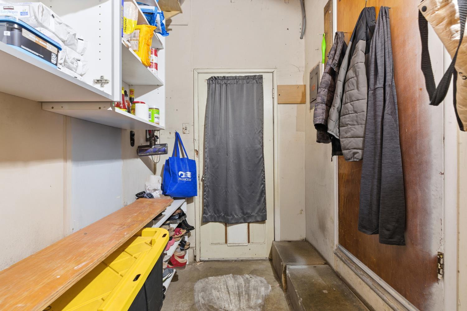 405 East Edison Street Manteca, CA 95336 - Photo 20 of 38 a view of walk in closet with clothes and shoes