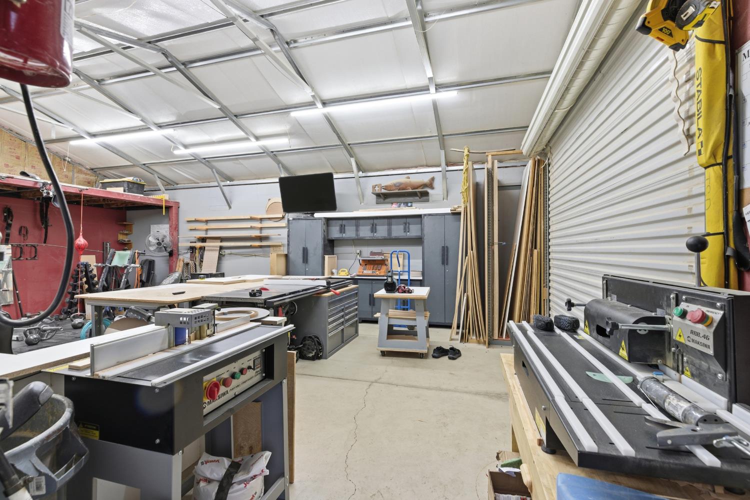 405 East Edison Street Manteca, CA 95336 - Photo 26 of 38 a storage room with washer and dryer