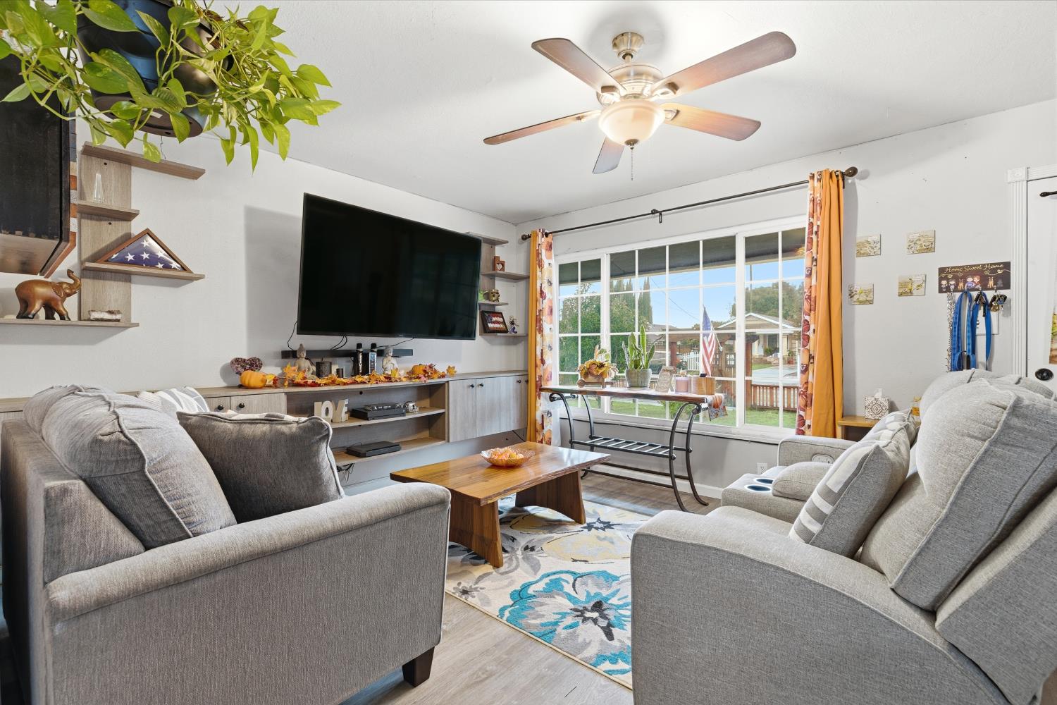 405 East Edison Street Manteca, CA 95336 - Photo 6 of 38 a living room with furniture and a flat screen tv
