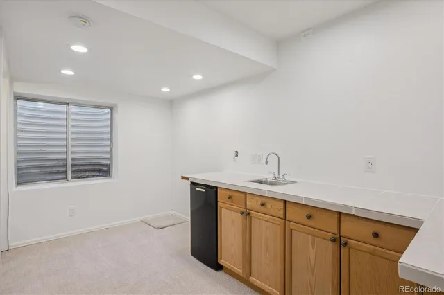 a view of a kitchen with a sink