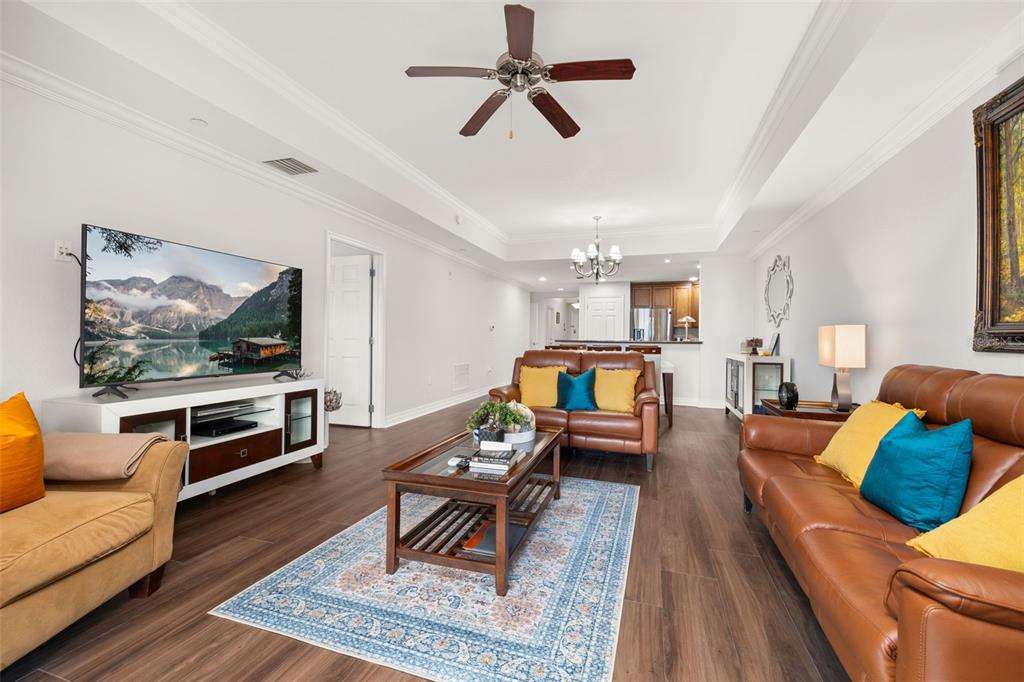 1100 Sunset View Circle, Unit 302 Reunion, FL 34747 - Photo 21 of 56 a living room with furniture and a flat screen tv