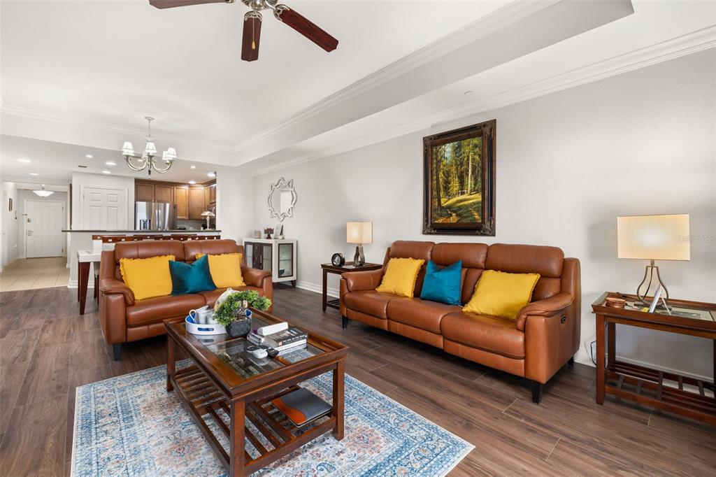 1100 Sunset View Circle, Unit 302 Reunion, FL 34747 - Photo 22 of 56 a living room with furniture and wooden floor