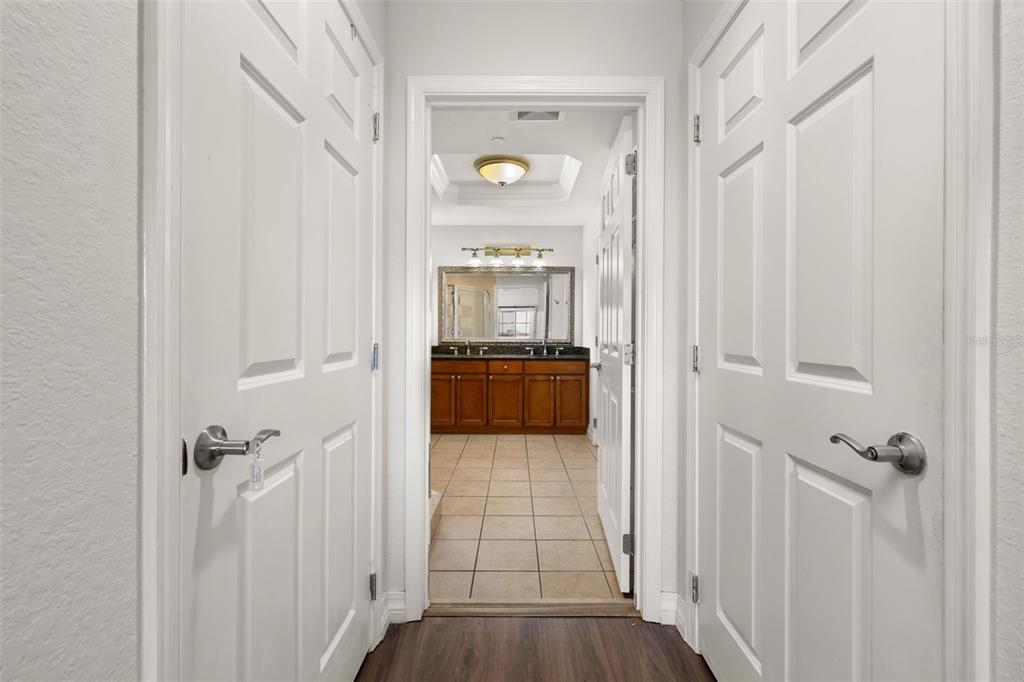 1100 Sunset View Circle, Unit 302 Reunion, FL 34747 - Photo 26 of 56 a view of a hallway view with wooden floor and staircase