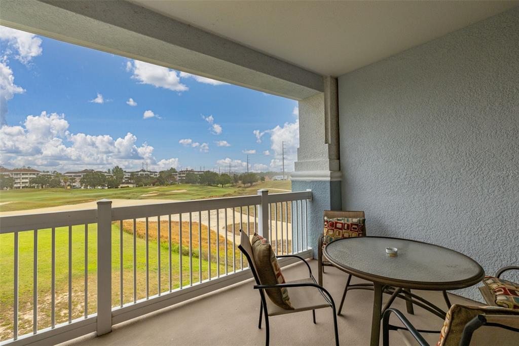 1100 Sunset View Circle, Unit 302 Reunion, FL 34747 - Photo 30 of 56 a view of a balcony with furniture
