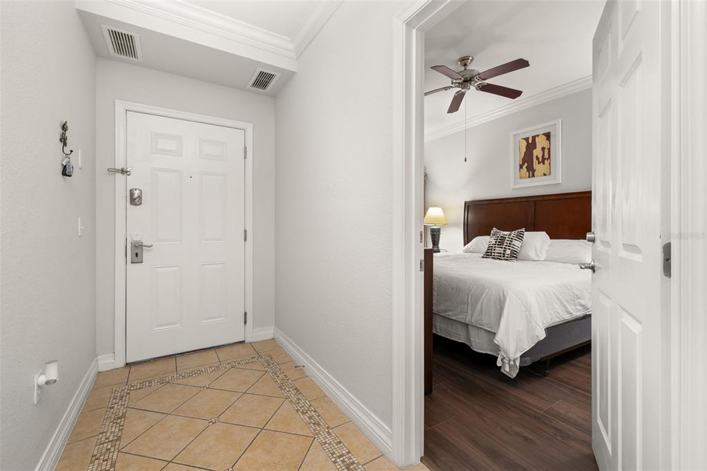 1100 Sunset View Circle, Unit 302 Reunion, FL 34747 - Photo 3 of 56 a bedroom with a bed and a cabinets