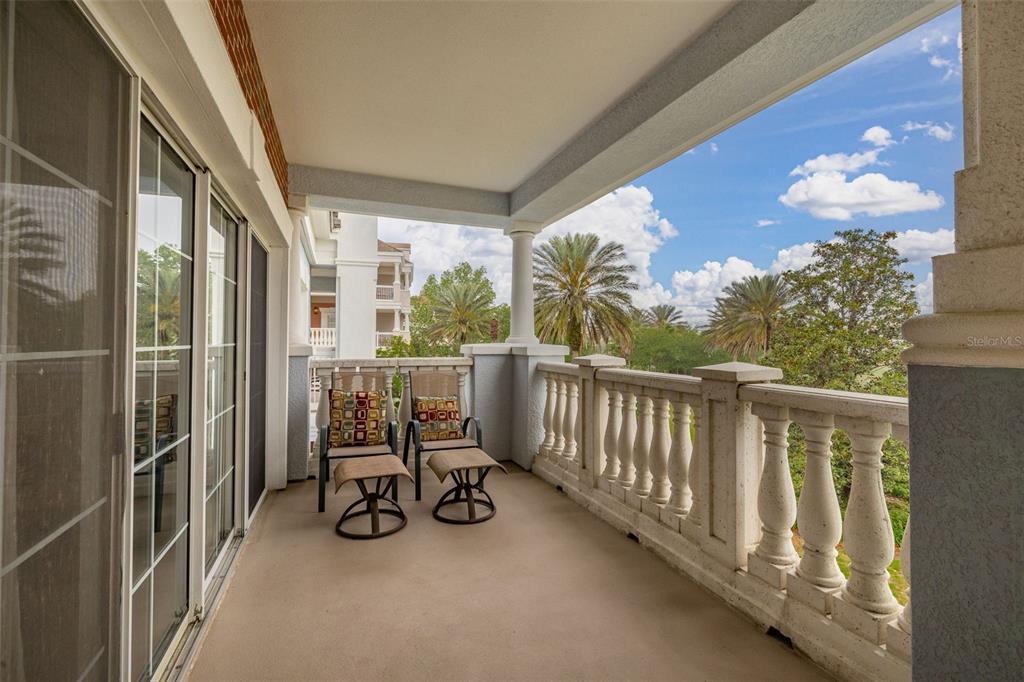 1100 Sunset View Circle, Unit 302 Reunion, FL 34747 - Photo 31 of 56 a view of a balcony with chairs