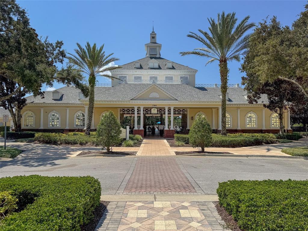 1100 Sunset View Circle, Unit 302 Reunion, FL 34747 - Photo 42 of 56 a front view of a building with a yard