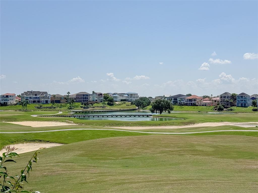 1100 Sunset View Circle, Unit 302 Reunion, FL 34747 - Photo 46 of 56 a view of a big yard with lawn chairs and large trees