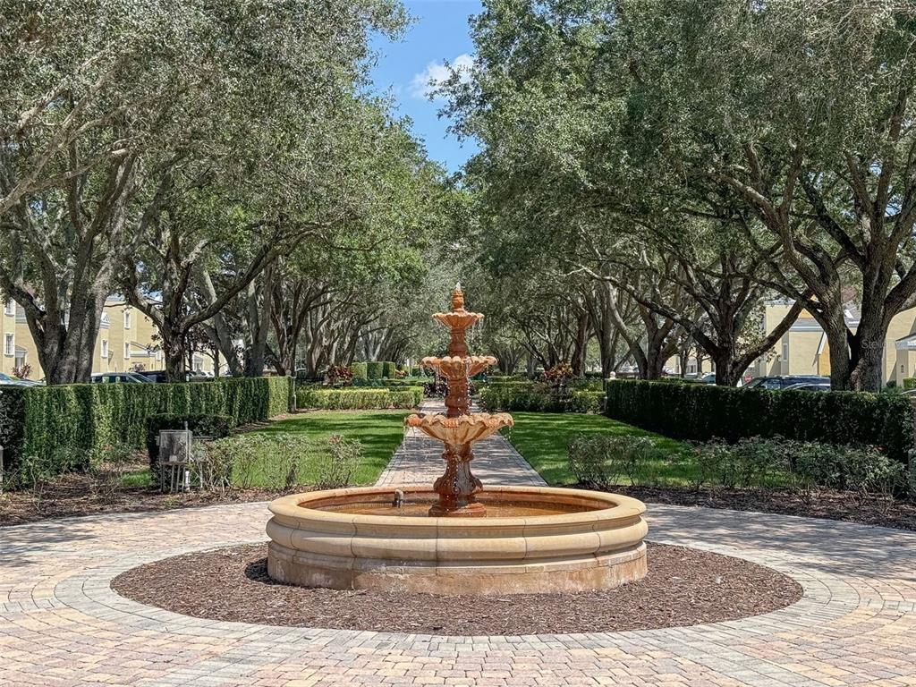 1100 Sunset View Circle, Unit 302 Reunion, FL 34747 - Photo 51 of 56 a park view with a fountain and large trees