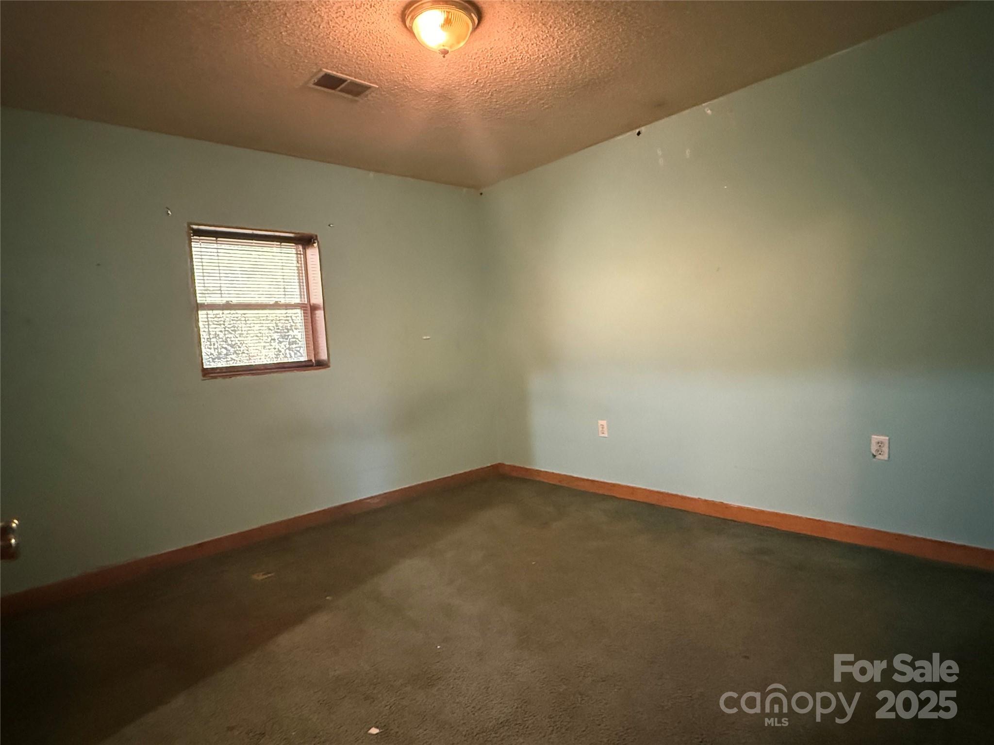 138 Rash Road Lincolnton, NC 28092 - Photo 15 of 41 an empty room with a window
