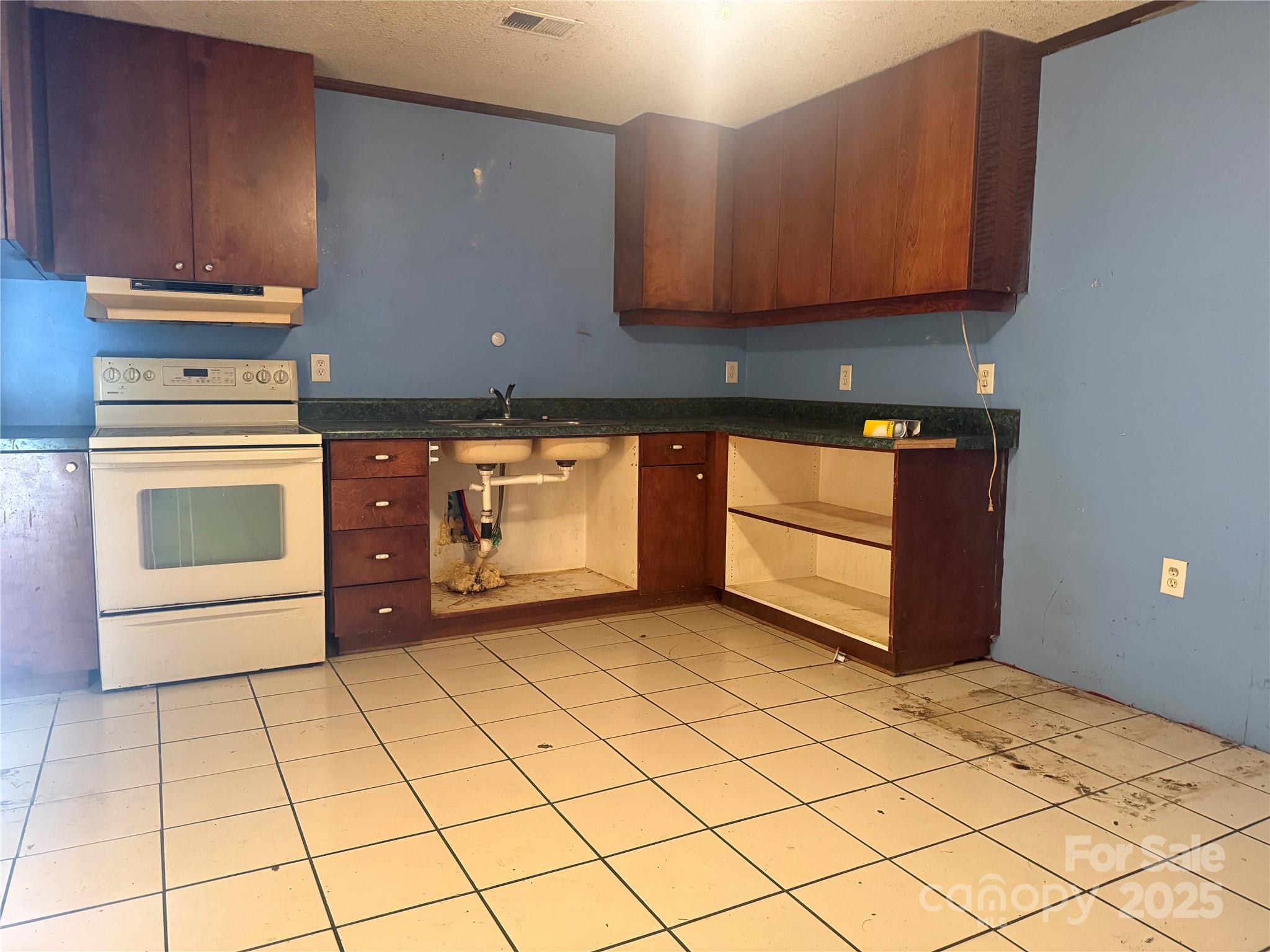 138 Rash Road Lincolnton, NC 28092 - Photo 3 of 41 a kitchen with stainless steel appliances granite countertop a stove a sink and a microwave