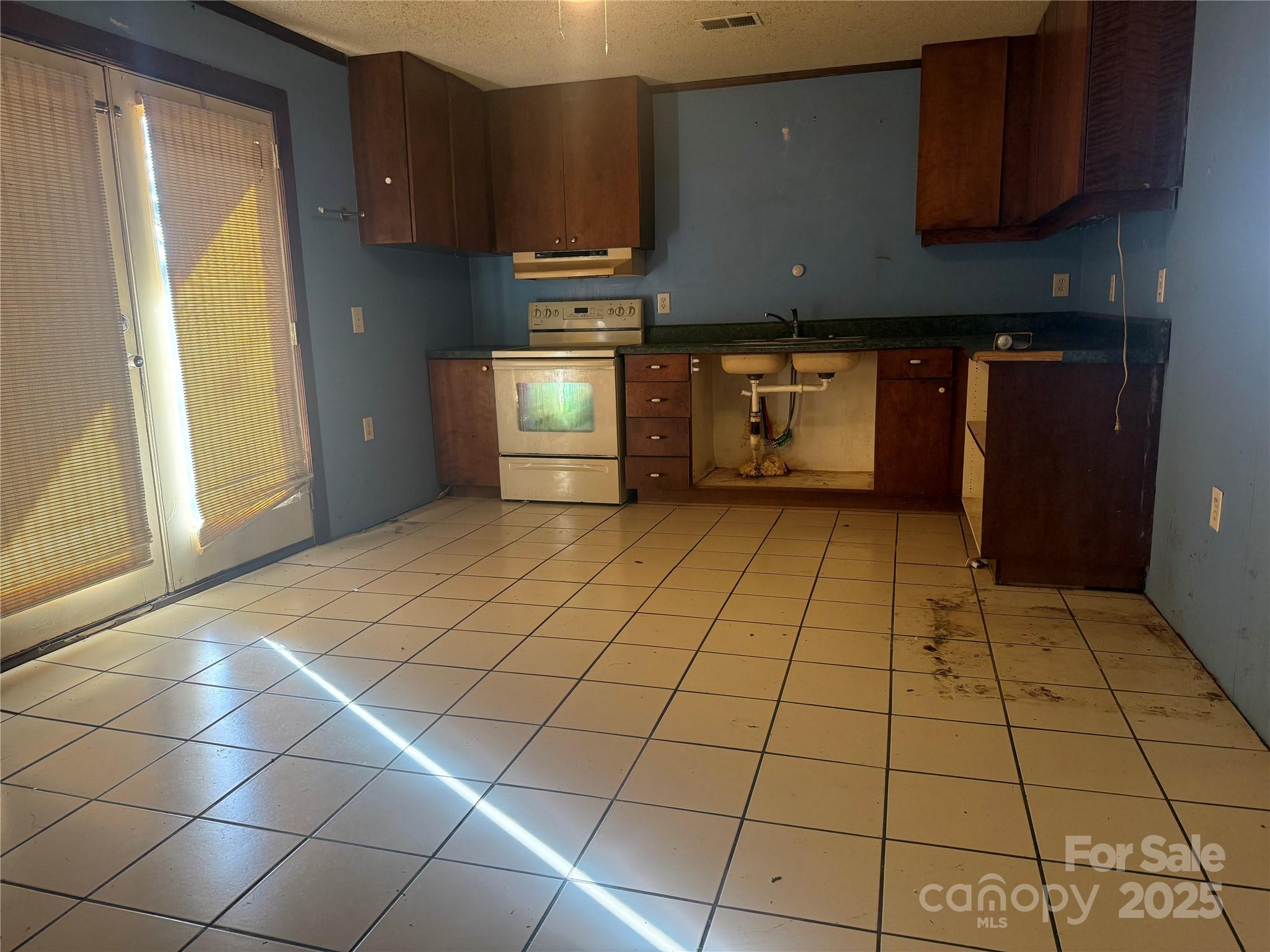 138 Rash Road Lincolnton, NC 28092 - Photo 4 of 41 a view of a refrigerator in kitchen and window