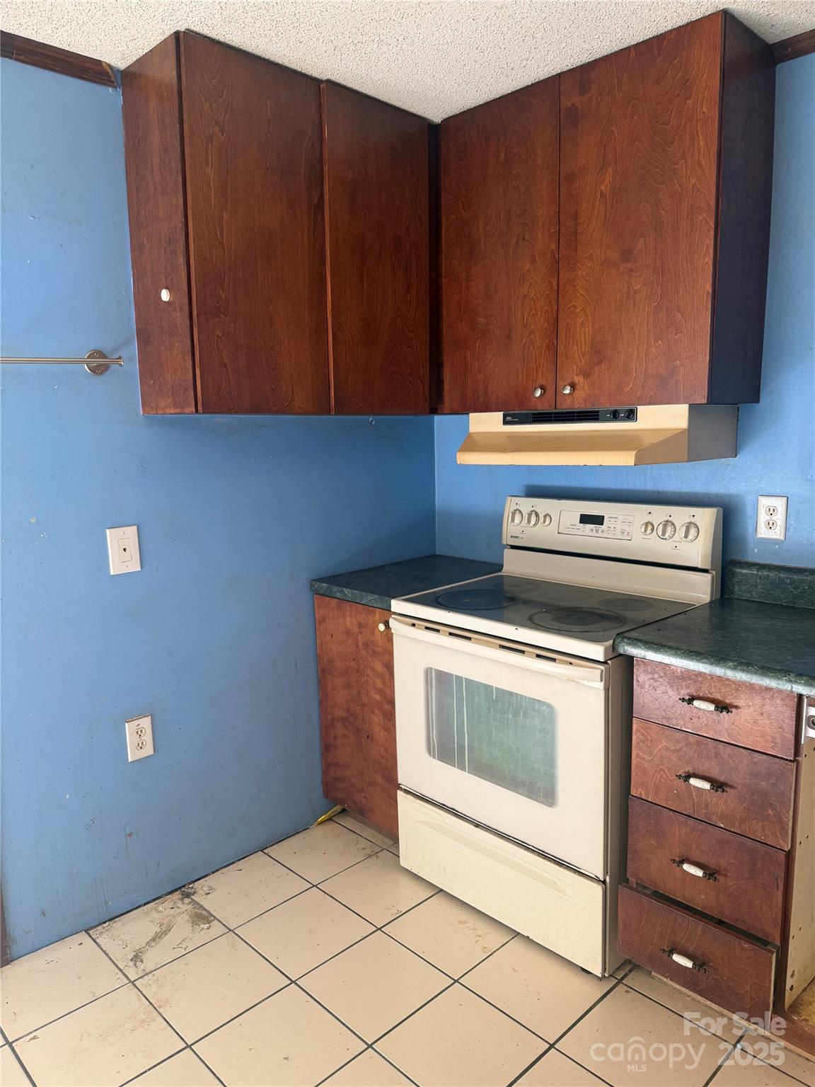 138 Rash Road Lincolnton, NC 28092 - Photo 5 of 41 a kitchen with granite countertop cabinets and a stove top oven