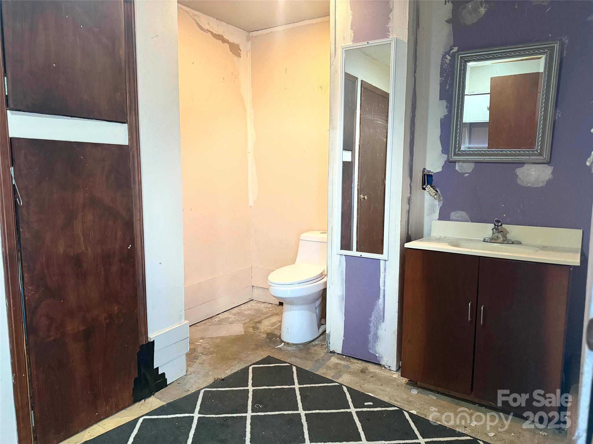 138 Rash Road Lincolnton, NC 28092 - Photo 6 of 41 a bathroom with a toilet and a sink