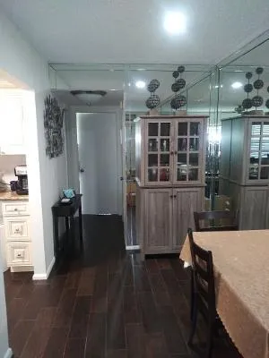 a view of gallery with wooden floor