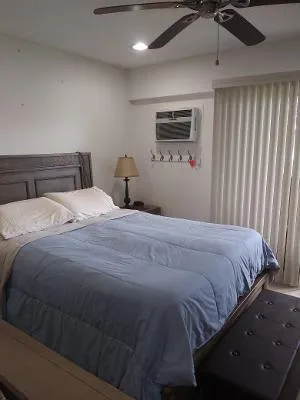 a bedroom with a bed and cabinets