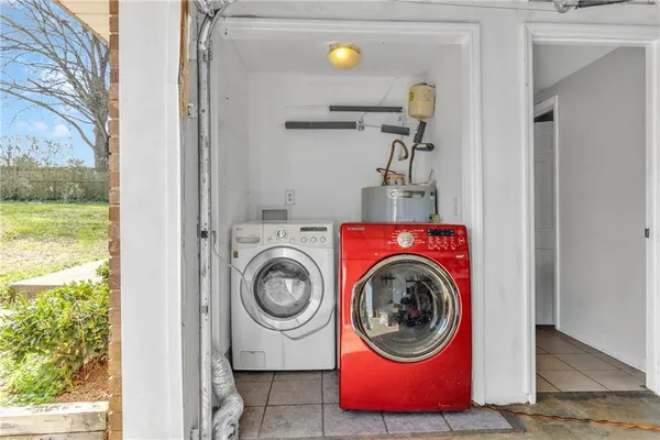 a utility room with dryer and washer