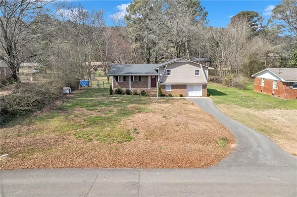 a house with trees in the background