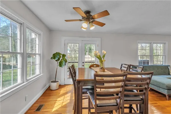 a view of a dining room with furniture window and outside view