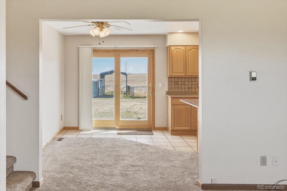 12720 South Mesa View Road Larkspur, CO 80118 - Photo 12 of 45 a view of an empty room with a window
