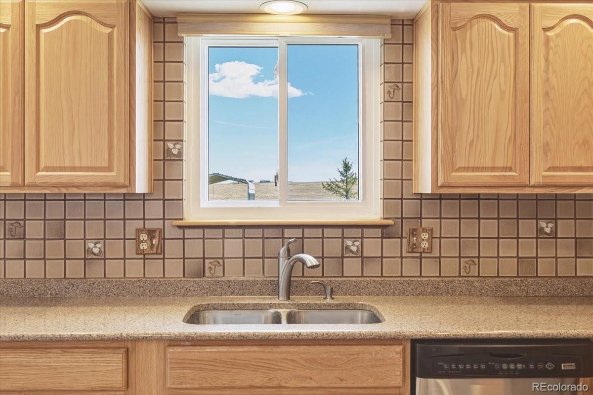 12720 South Mesa View Road Larkspur, CO 80118 - Photo 17 of 45 a close view of a sink and a mirror