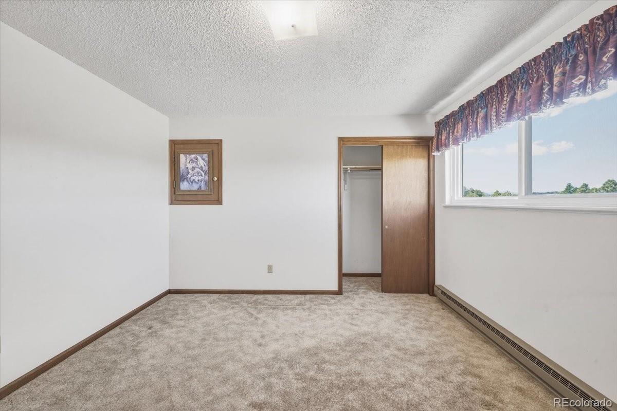 12720 South Mesa View Road Larkspur, CO 80118 - Photo 22 of 45 an empty room with a empty space