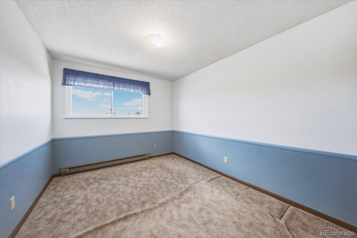12720 South Mesa View Road Larkspur, CO 80118 - Photo 25 of 45 an empty room with a window