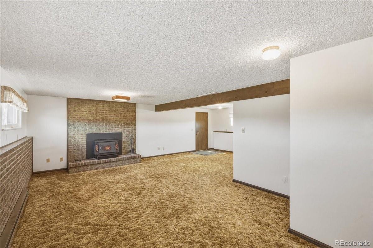 12720 South Mesa View Road Larkspur, CO 80118 - Photo 28 of 45 an empty room with windows