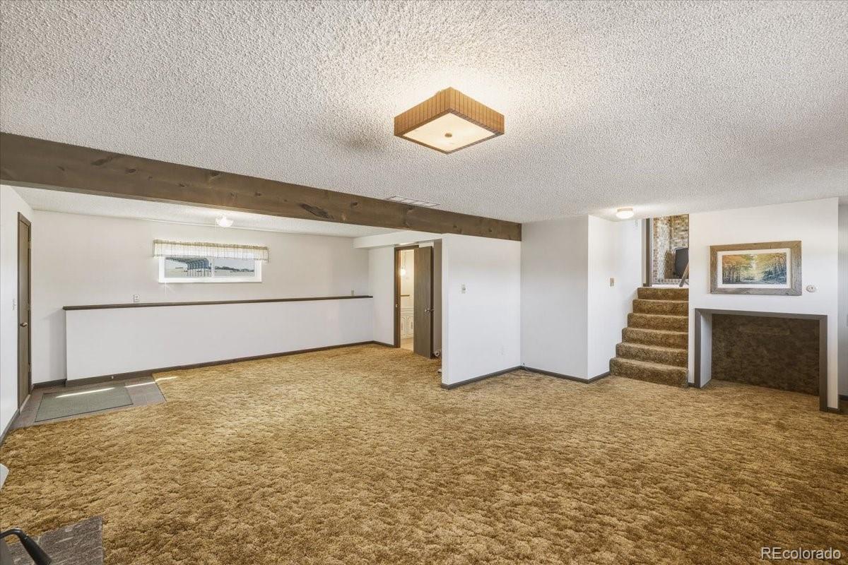 12720 South Mesa View Road Larkspur, CO 80118 - Photo 29 of 45 a view of an empty room with a window
