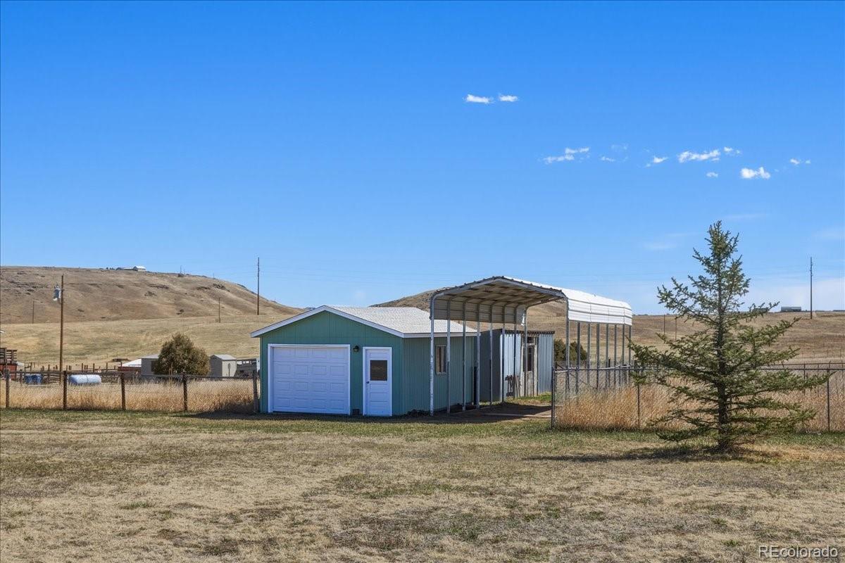 12720 South Mesa View Road Larkspur, CO 80118 - Photo 36 of 45 a house view with a outdoor space