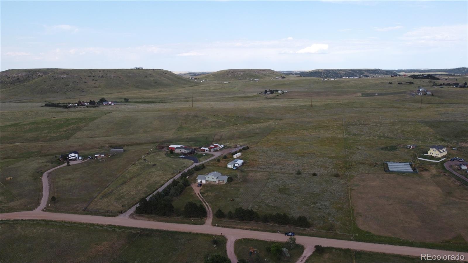 12720 South Mesa View Road Larkspur, CO 80118 - Photo 42 of 45 a view of a terrace with a lake view