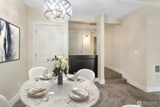 a living room with furniture and a rug