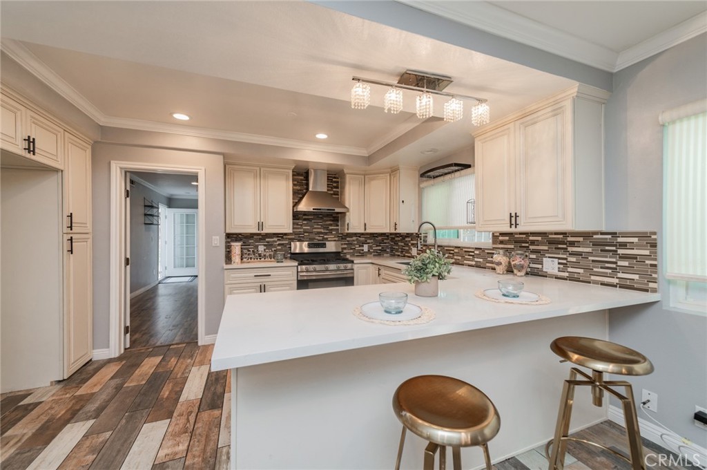 9163 Duarte Road San Gabriel, CA 91775 - Photo 11 of 38 a kitchen with stainless steel appliances a sink stove and refrigerator