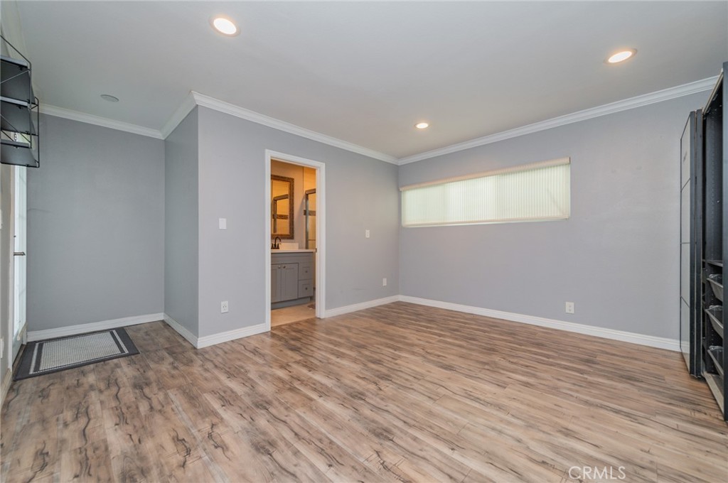 9163 Duarte Road San Gabriel, CA 91775 - Photo 17 of 38 wooden floor in an empty room with a window