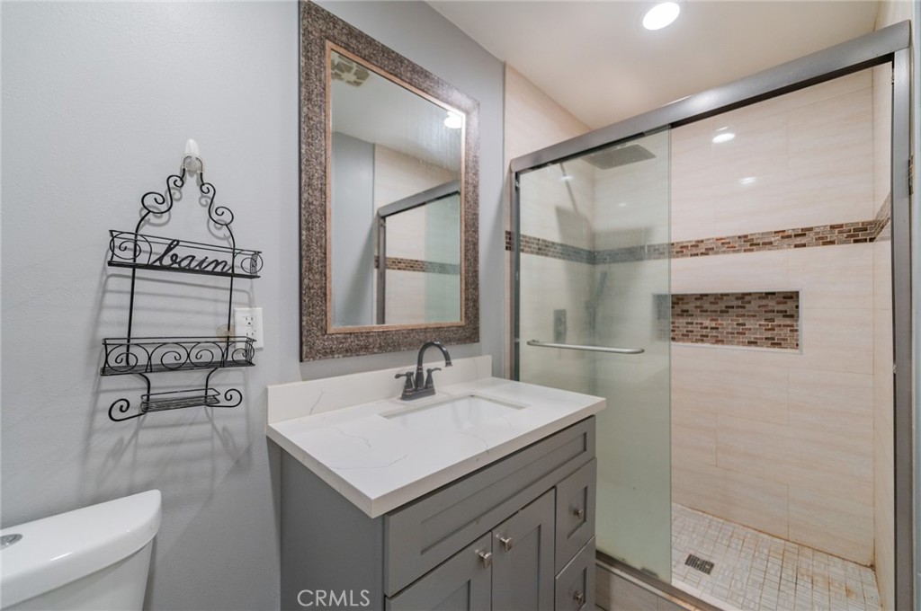 9163 Duarte Road San Gabriel, CA 91775 - Photo 19 of 38 a bathroom with a sink and a mirror
