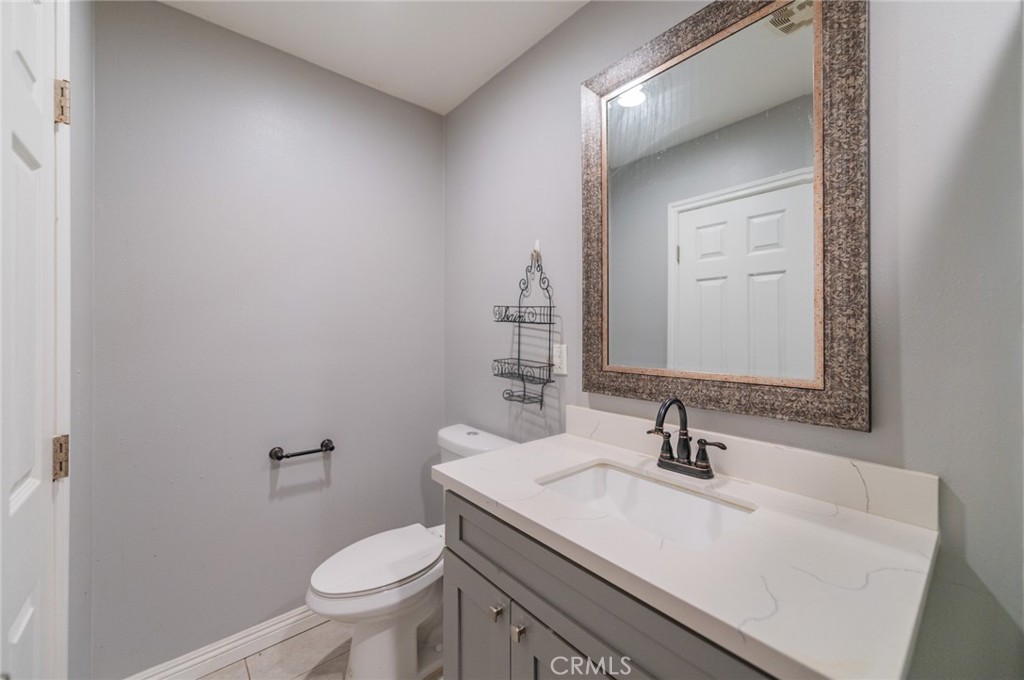 9163 Duarte Road San Gabriel, CA 91775 - Photo 20 of 38 a bathroom with a sink toilet and mirror